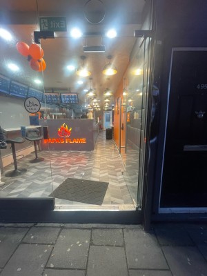 Glass door ahead. Push silver metal handle on left to open.
