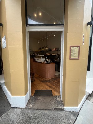 White wooden double doors. Push from middle.