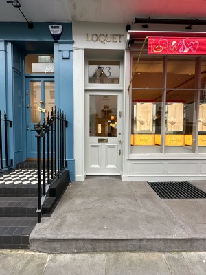 From pavement facing venue. Path ahead leads to entrance.