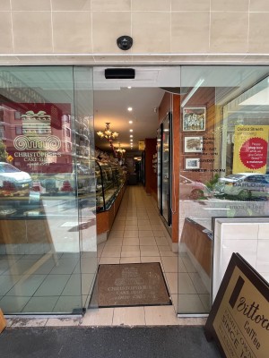 Glass door slides open to left.