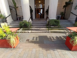From street, facing venue. Planter on both sides.