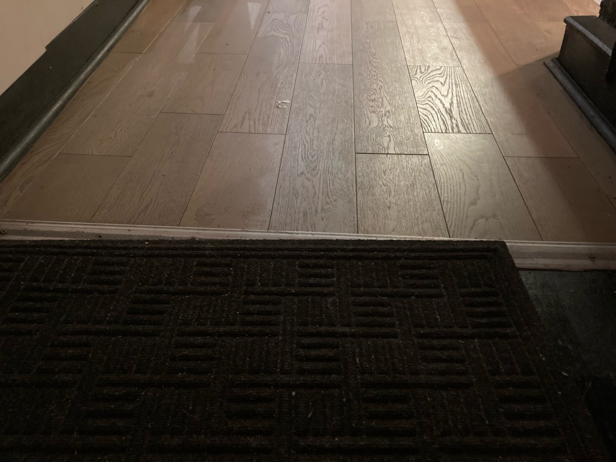 Doormat followed by small bump on path.