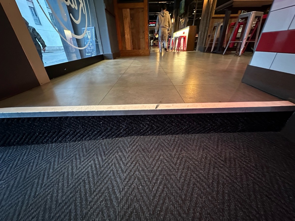 One step up at foot of opening.