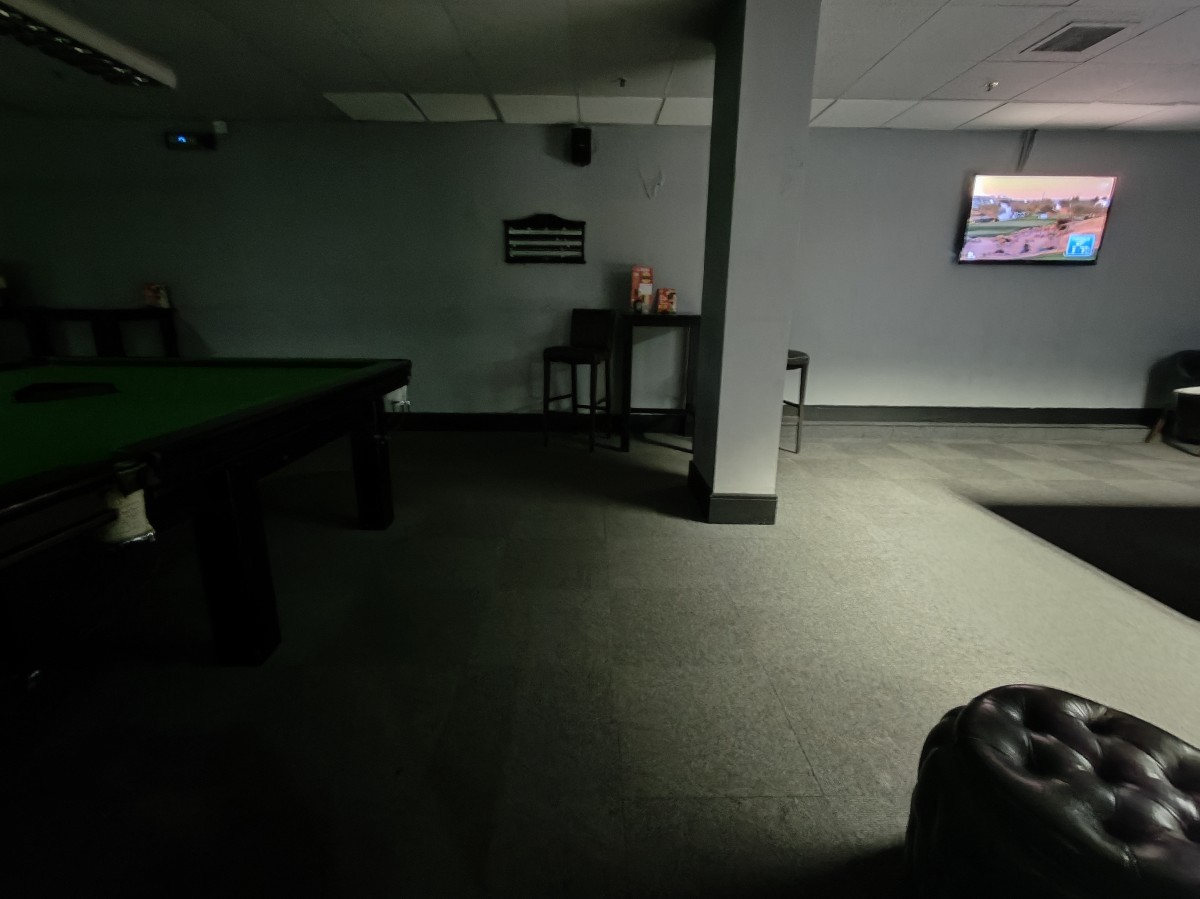 From left of column facing straight. Stool on right and along back wall.