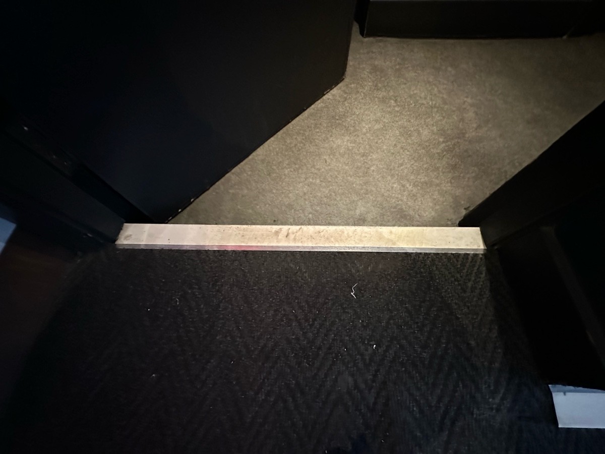 One step down at foot of preceding door.