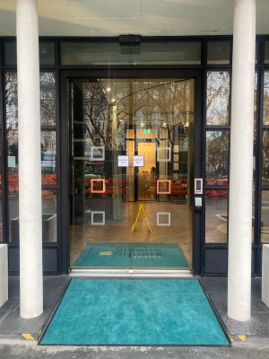 Opening ahead with two white pillars on the sides.