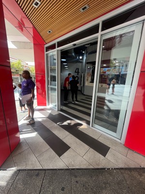 Path to entrance from street. Door on right ahead.
