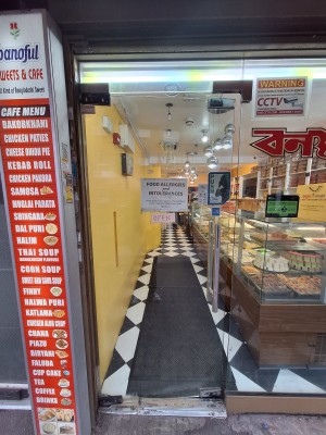 Glass door ahead. Push metal handle on right to open.