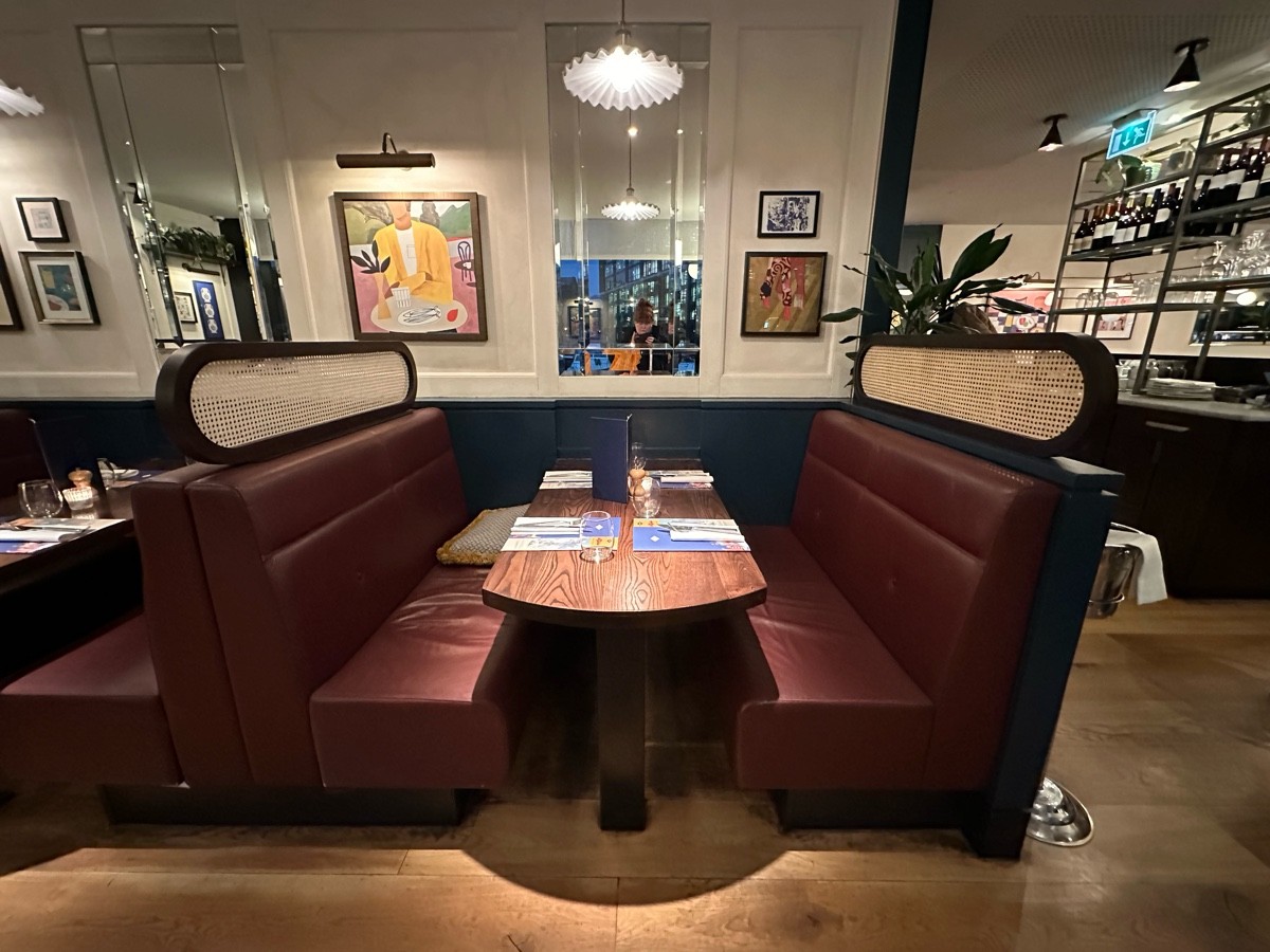 From tables and chairs facing right. Booths ahead.