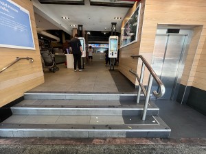 Open archway to venue. Stairs ahead, lift ahead to right.