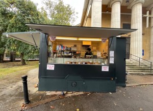 From pavement facing kiosk. Till on right. Pick up on left.