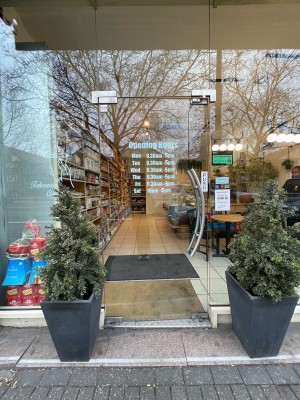 Single glass door. Push sliver handle to open.
