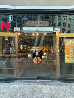 Glass doors. Push wooden handles in centre to open.