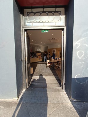 Black wooden doors, push from middle to open.