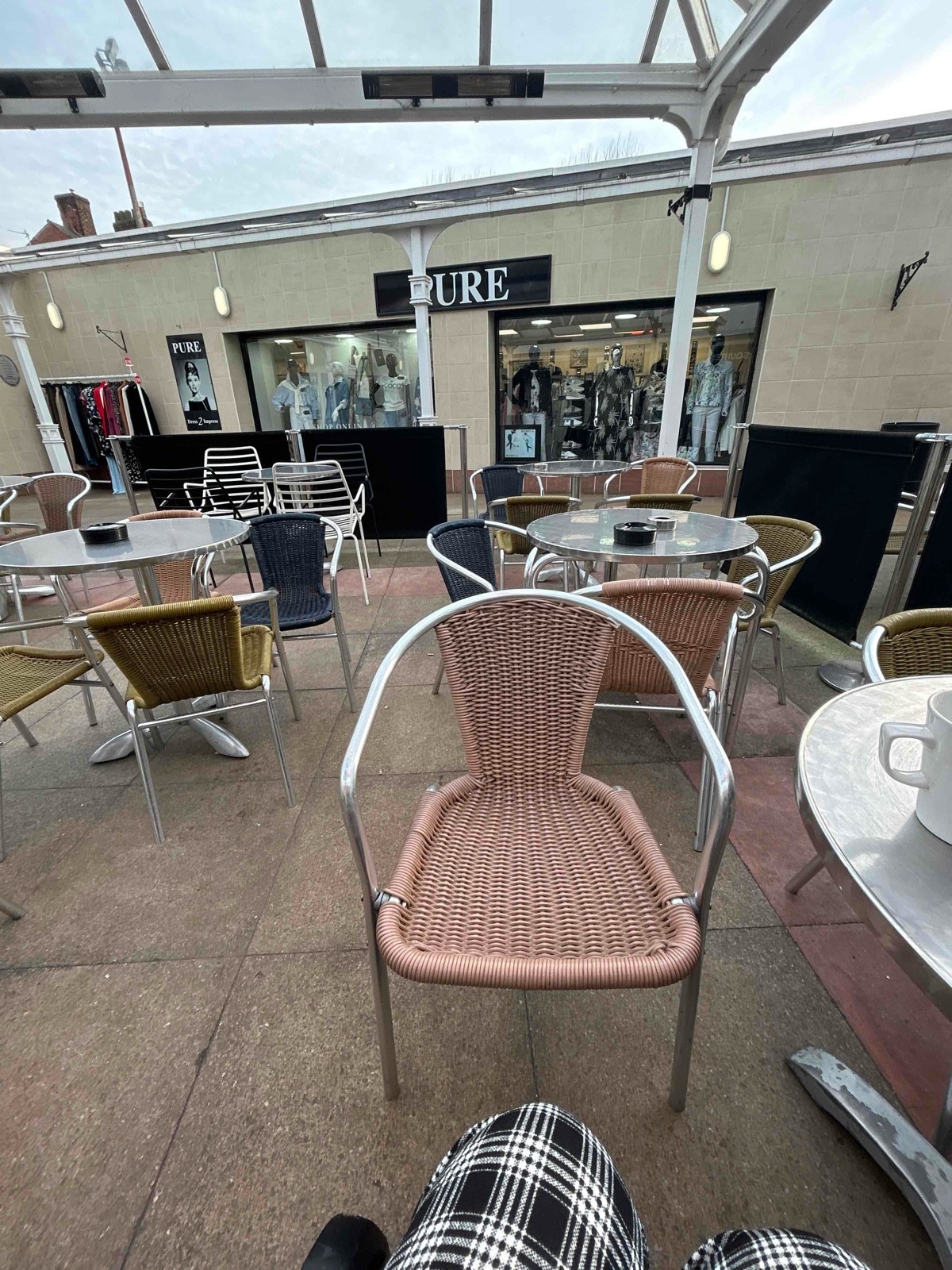 Cramped undercover seating with not much room in between table and chairs