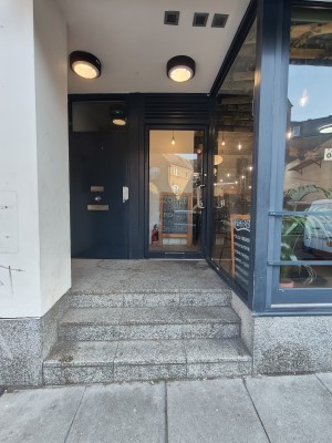 Three steps up to entrance door.