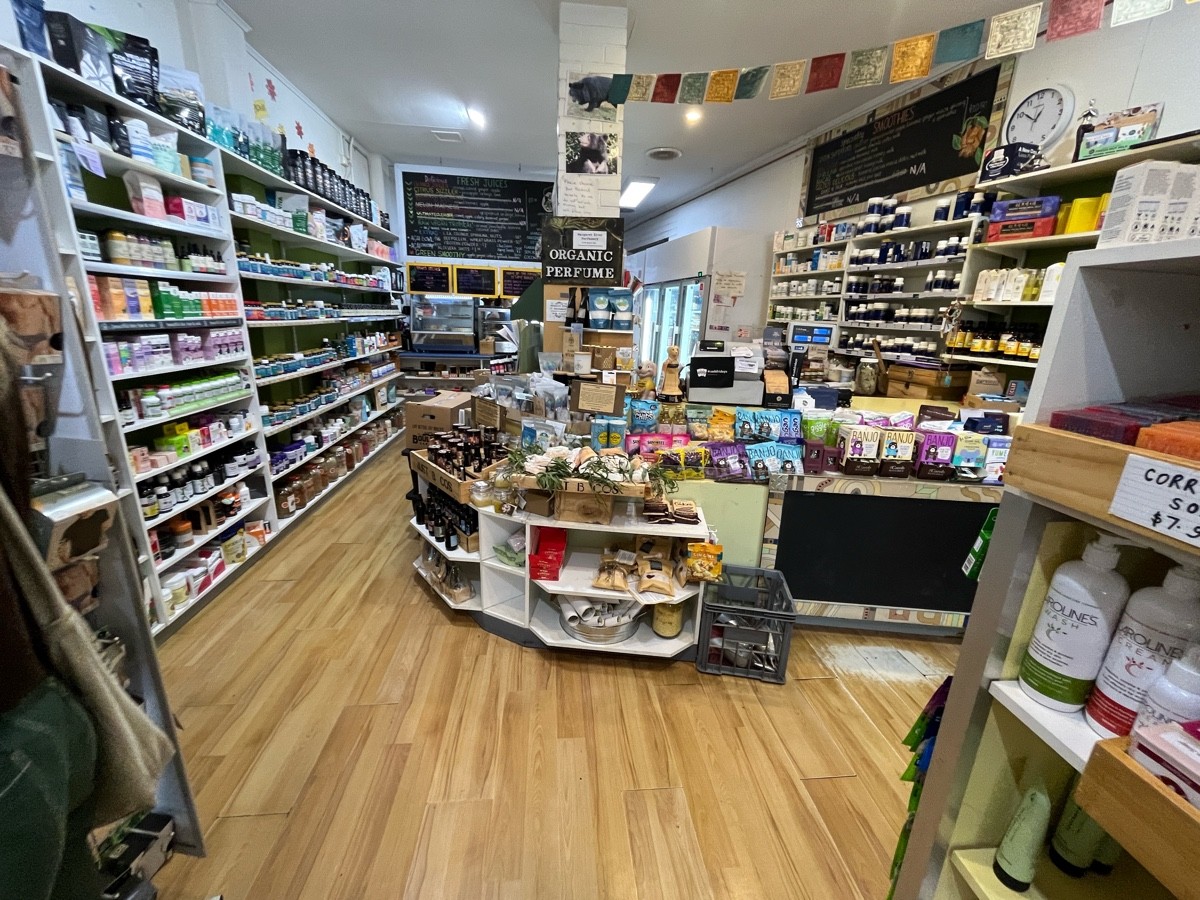 From after buckets facing straight. Shop shelves ahead. Path shifts left ahead.