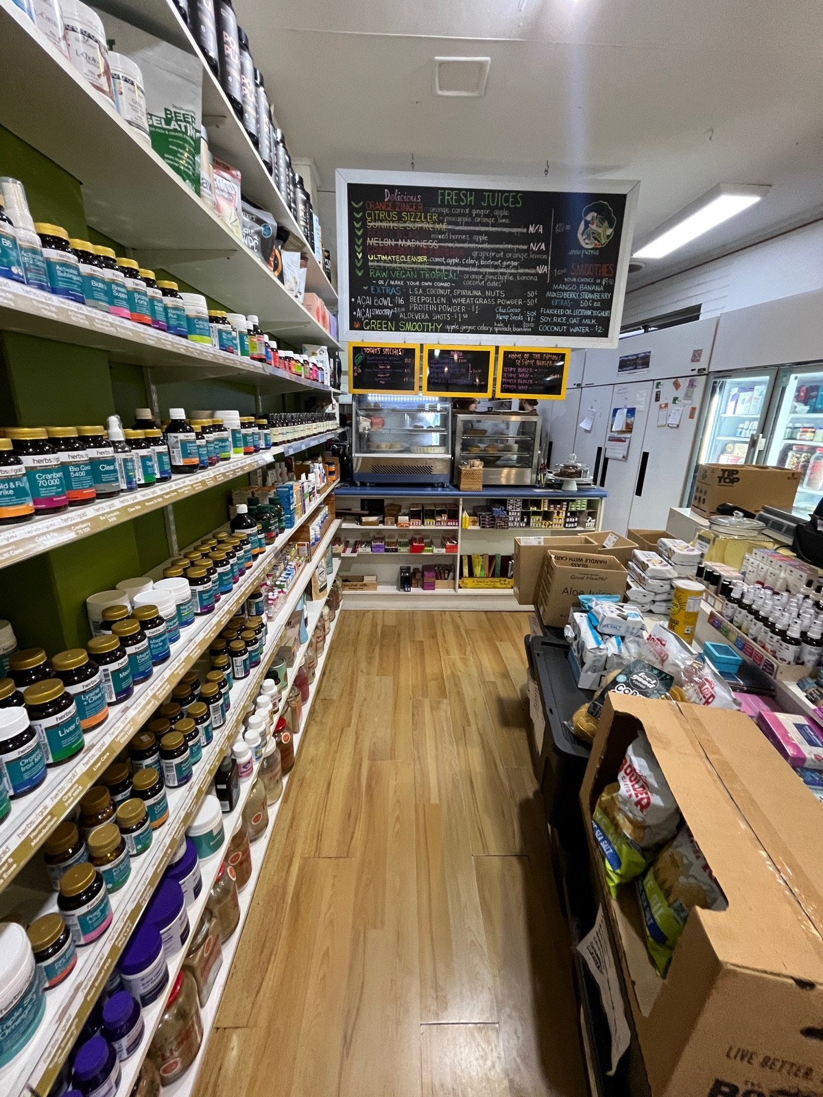 From left of shelves facing straight. Service counter directly ahead.