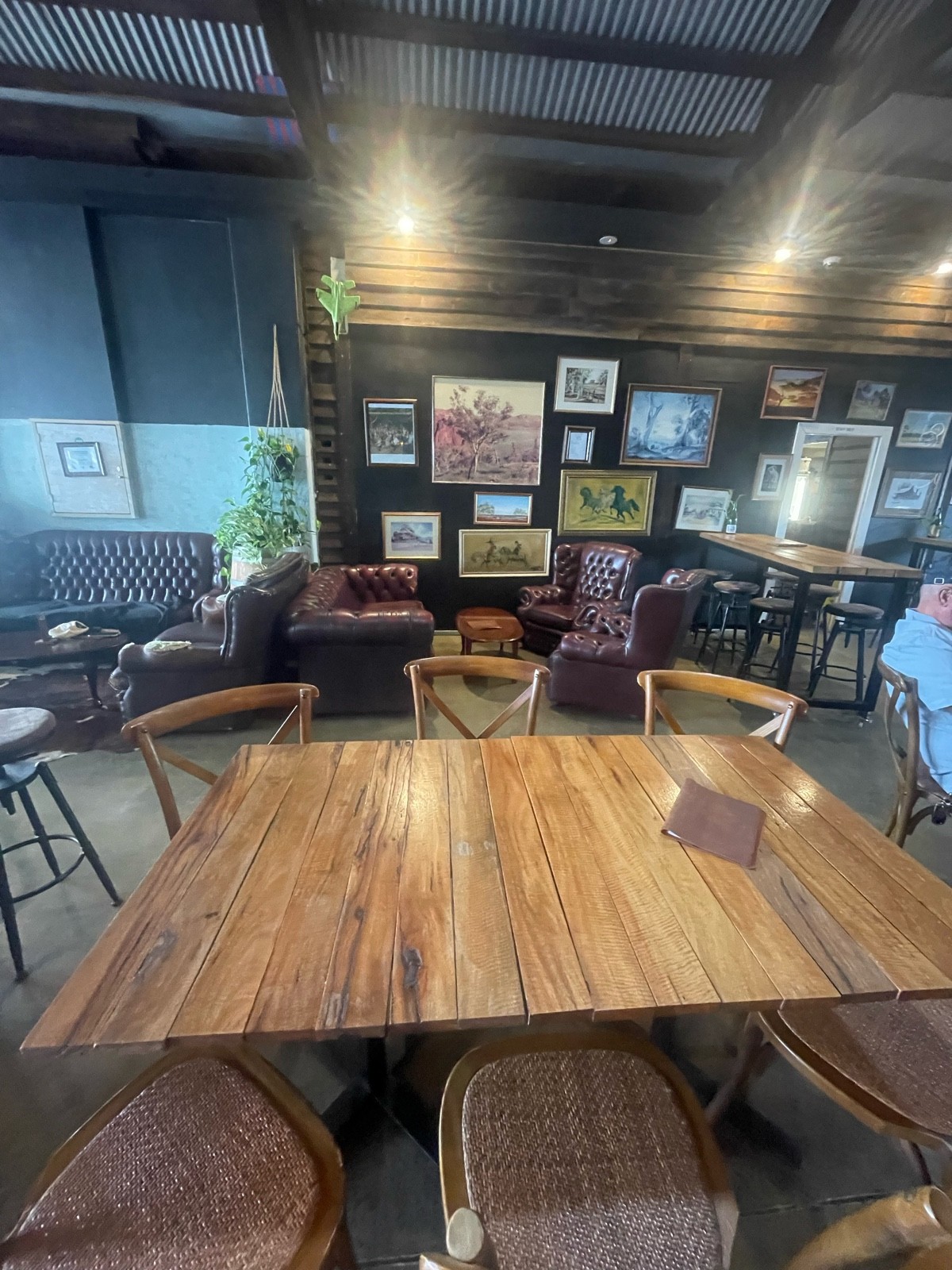 Standard height table and chairs area. Chesterfield lounge area to the rear