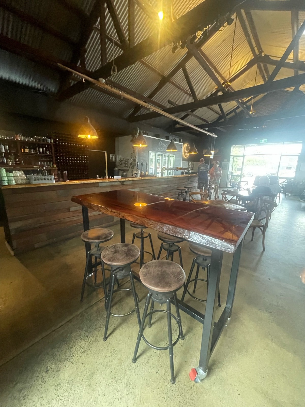 High bar table with stools. Standard table and chairs to the rear
