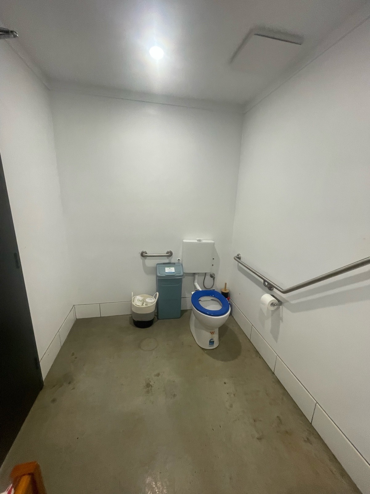 Toilet with space to the left for wheelchair transfer