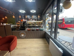 From entrance facing straight. Seating on left. Counter along back wall.