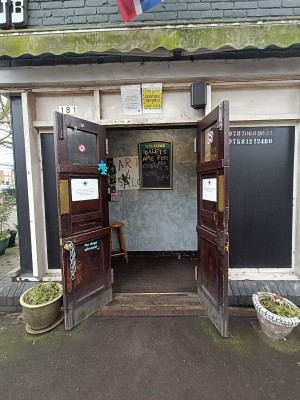 Brown wooden doors with golden handles in middle. Pull from middle to open.