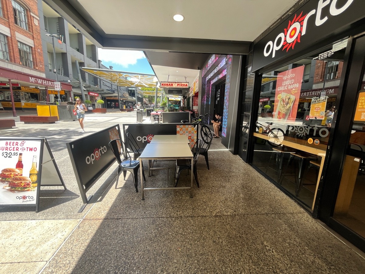 From entrance facing left. Tables and chairs ahead to left.
