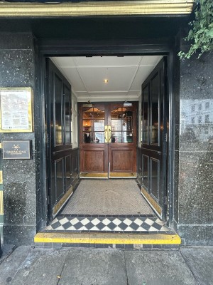 Preceding black wooden doors ahead. Push from middle to open.