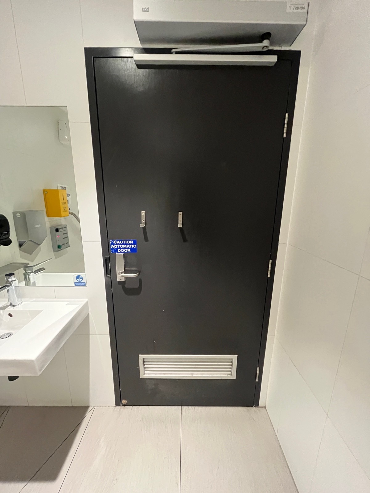 Back of door. Door opens inwards from left. Hanging hooks in middle.