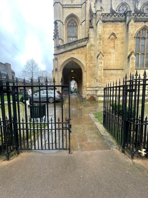 From street facing venue. Black metal gates ahead. Push from centre to open. Doors remain open during opening hours.