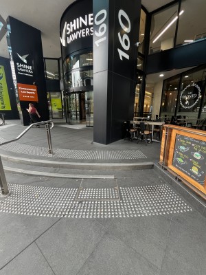 Path to entrance from street. Steps to entrance ahead.