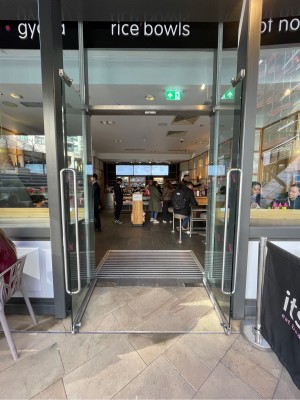 Metal-framed glass doors. Pull from silver handles at centre to open.