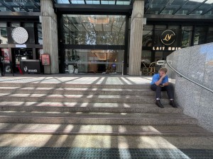 Steps up to entrance. Handrail on right. Tactile flooring both ends.
