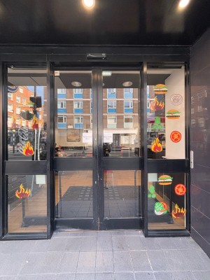 Sliding glass doors with black frame ahead.