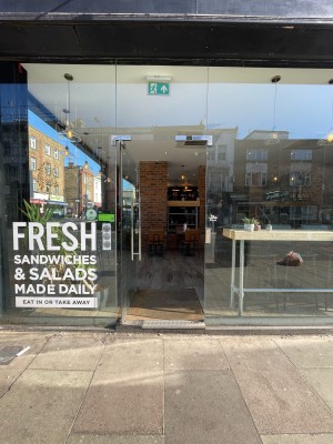 Glass door. Push from silver handle on right to open.