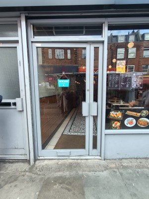 Grey framed glass doors. Push grey handles in centre to open.