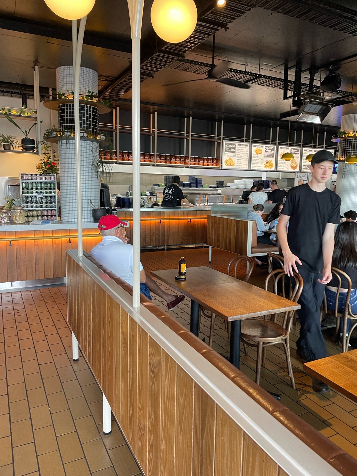 Tables inside as well but most people sit outside opposite water
