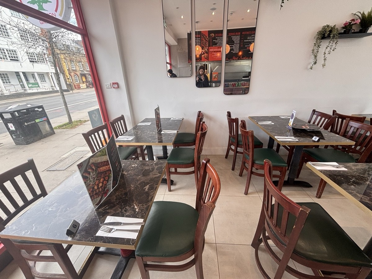 From entrance facing left. Tables and chairs ahead.