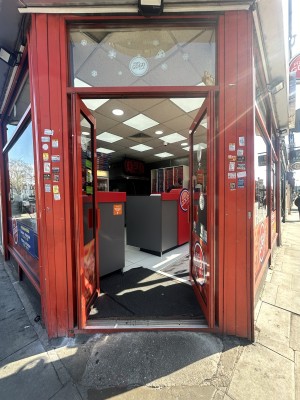 Glass doors with red frames ahead. Push red handles in centre to open.