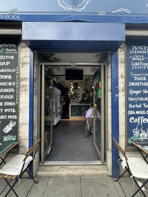 Glass doors with blue frame. Push silver handles in centre to open.