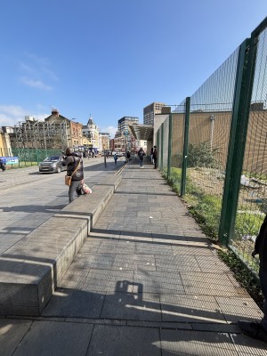 From right end of DLR station facing left. Built in ramp slopes up ahead. Station entrance at the top.