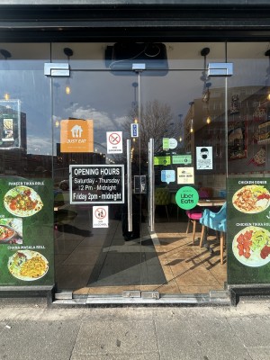 Glass doors ahead with silver handles in centre. Push to open.