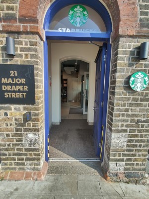 Blue door. Push silver handle in centre to open.