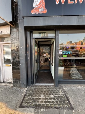 Glass door with black frame ahead.