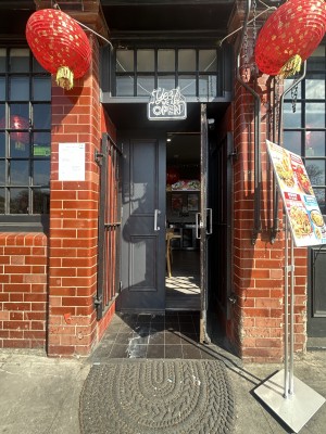 Grey wooden doors ahead. Pull silver handles in centre to open.