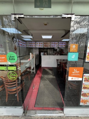 Glass door. Push from metal handle on right to open.