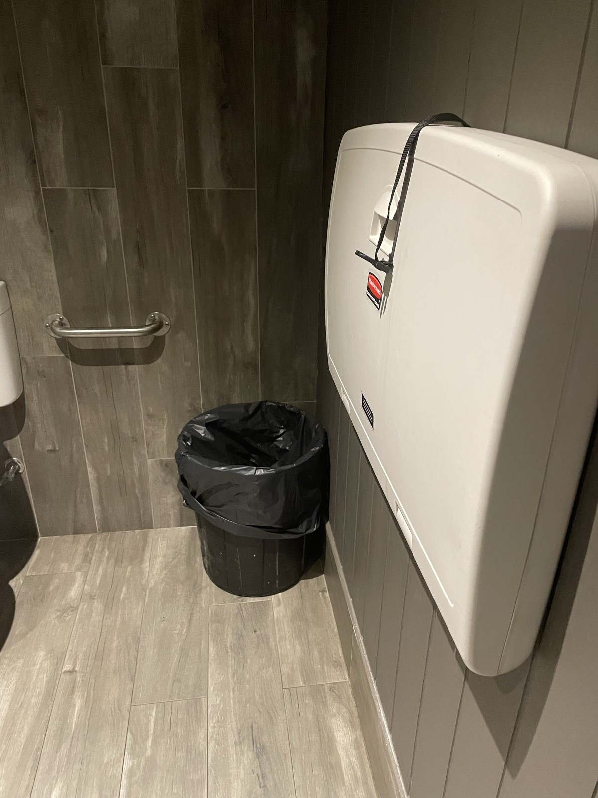 Open waste bin & nappy change area