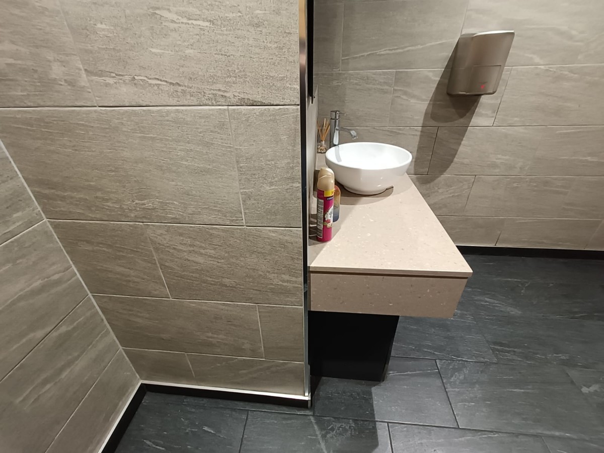 From door facing straight. Sink at back.