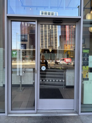 Glass door ahead. Approach to open.